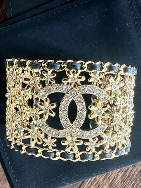 CHANEL Gold Crystal CC Filigree Cuff Bracelet with Black Leather Weave